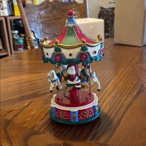 Avon Holiday Santa Carousel with Red and Blue Details
